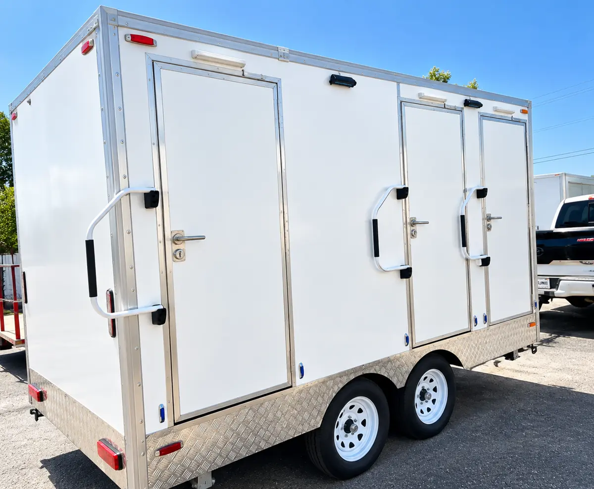13ft 3-stall shower and restroom combination trailer on a tandem-axle chassis