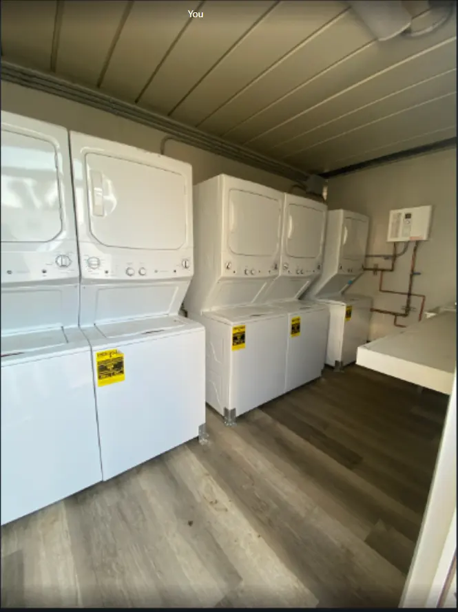 Washers and dryers inside a 20ft laundry container